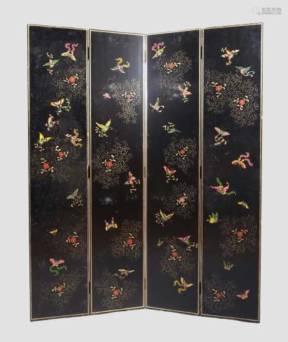 A Chinese black lacquered four fold screen, 20th century, gi...