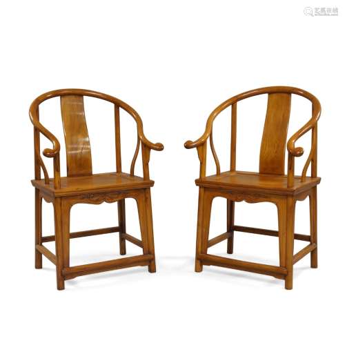 A pair of Chinese horseshoe-back wood chairs, quanyi Late Qi...