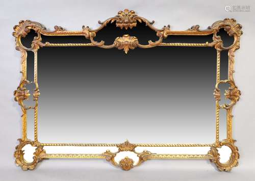 An English giltwood sectional mirror, George III style, last...