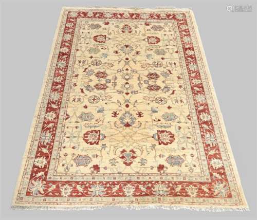 A Ziegler rug, the central field with geometric floral desig...
