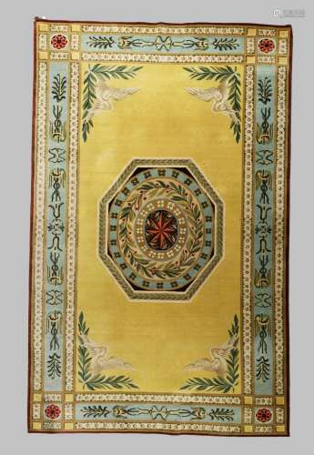 A large modern carpet, with central octagonal medallion on a...