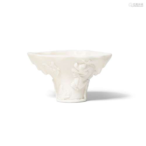 A DEHUA MOLDED 'IMMORATLITY' LIBATION CUP 18th century