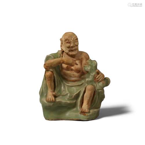 A LONGQUAN CELADON-GLAZED BISCUIT FIGURE OF VIJRAPUTRA Ming ...