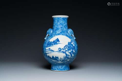 A Chinese blue and white 'hu' vase with elephant head handle...
