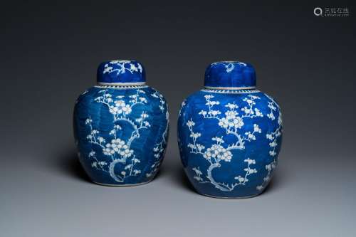 A pair of Chinese blue and white jars and covers, 19th C.