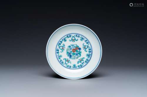 A Chinese doucai saucer with floral design, Yongzheng mark, ...