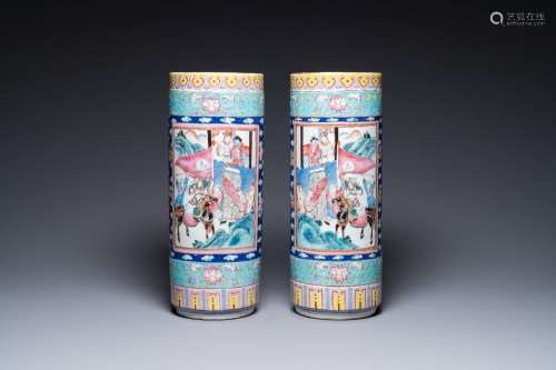 A pair of Chinese famille rose cylindrical vases, 19th C.