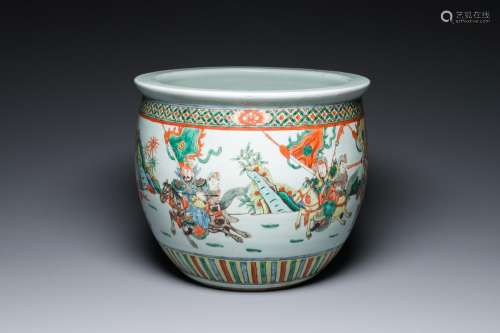 A Chinese famille verte fish bowl with warriors on horseback...