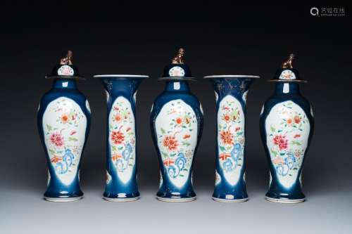 A Chinese blue-ground famille rose garniture of five vases w...