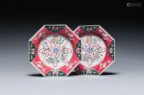 A pair of Chinese octagonal famille rose ruby-ground plates,...