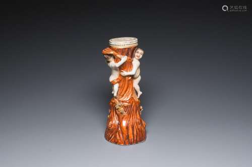 A Chinese faux-bois export porcelain stand with two young bo...