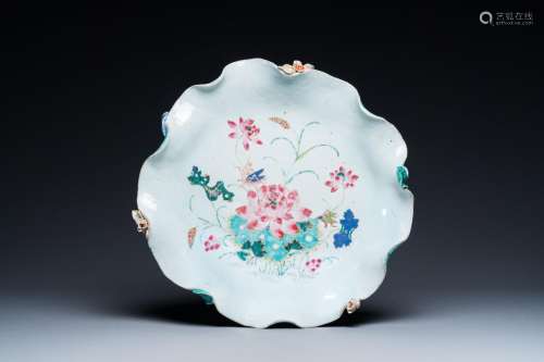 A large Chinese famille rose 'lotus' dish with applied desig...