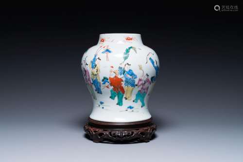 A Chinese famille rose 'playing boys' vase on a fine carved ...