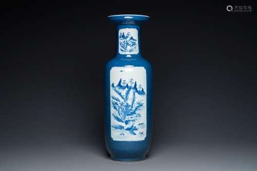 A Chinese blue-ground rouleau vase with blue and white lands...