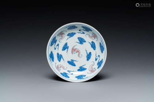 A Chinese blue, white and copper-red 'Bats and clouds' plate...