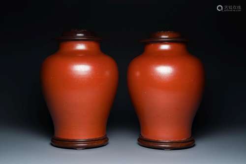 A pair of Chinese monochrome coral-red-glazed vases with woo...