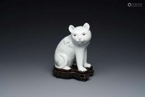 A Chinese blanc de Chine model of a cat on wooden stand, Rep...