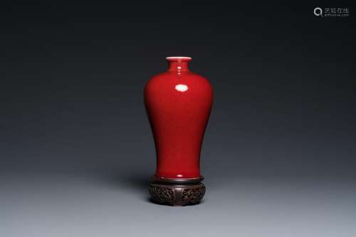 A Chinese monochrome copper-red-glazed 'meiping' vase on woo...