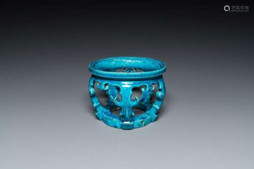 A Chinese monochrome turquoise-glazed reticulated ornament f...