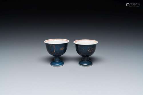A pair of Chinese powder blue stem cups with gilt decoration...