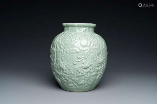 A Chinese relief-molded monochrome celadon-glazed vase, 19/2...