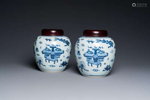 A pair of Chinese blue and white ‘antiquities’ jars with woo...