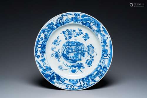 A large Chinese blue and white dish with raised central meda...