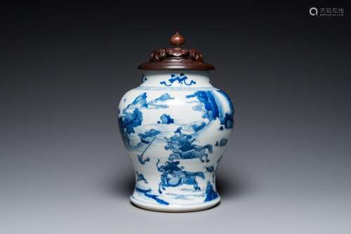 A Chinese blue and white 'Mongolian hunt' jar with wooden co...