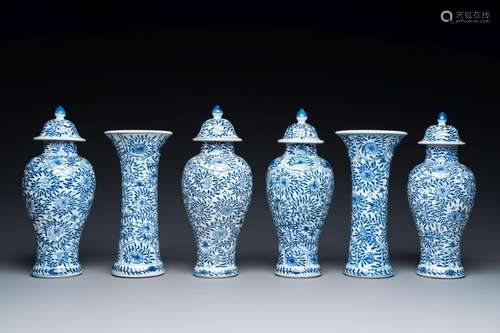 A Chinese blue and white garniture of six vases with floral ...