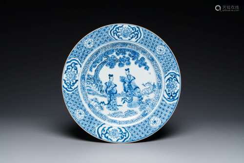 A Chinese blue and white dish with two ladies in a garden, Y...