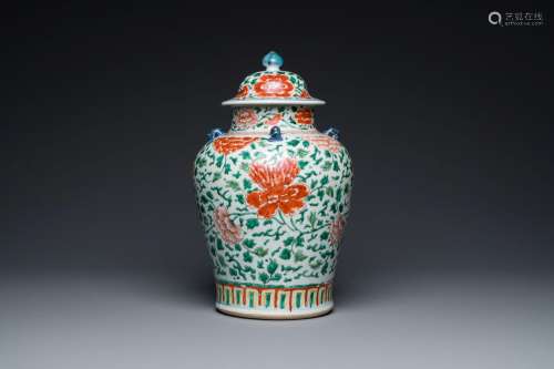 A Chinese 'peony scroll' famille verte vase and cover, Kangx...
