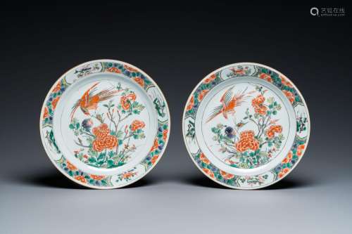 A pair of Chinese famille verte plates with a bird above a p...