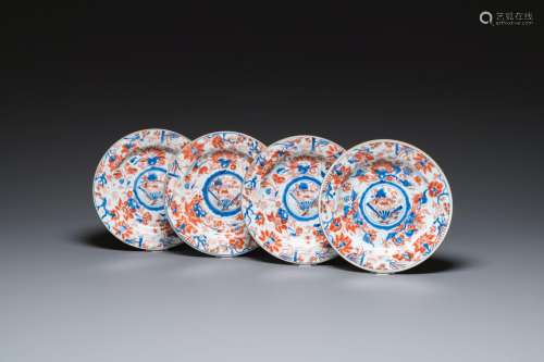 Four Chinese Imari-style plates with raised central roundels...