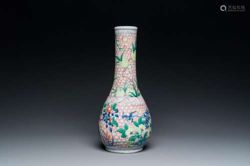 A Chinese wucai bottle vase with birds surrounded by fruits ...