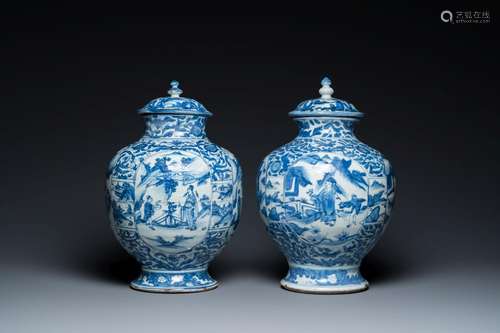 A pair of Chinese blue and white vases and covers with figur...