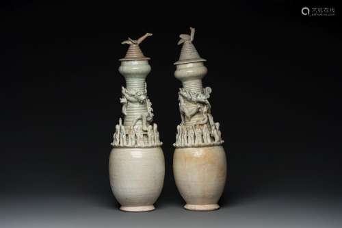 Two large Chinese qingbai-glazed covered urns with applied d...
