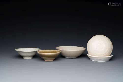 Three Chinese celadon- and qingbai-glazed bowls and a cream-...