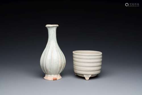 A Chinese qingbai wall pocket vase and a three-legged incens...