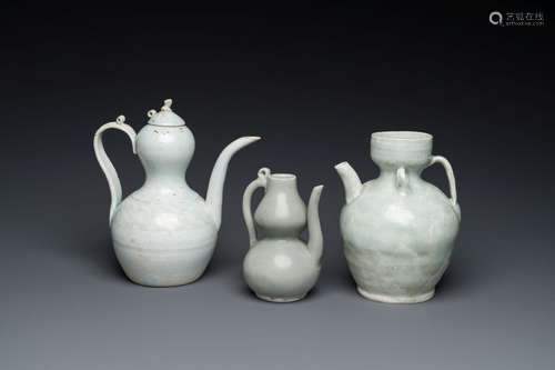 Three Chinese celadon- and qingbai-glazed jugs, Song and lat...