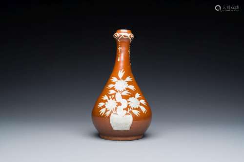 A Chinese slip-decorated brown-ground bottle vase, Zhushan k...