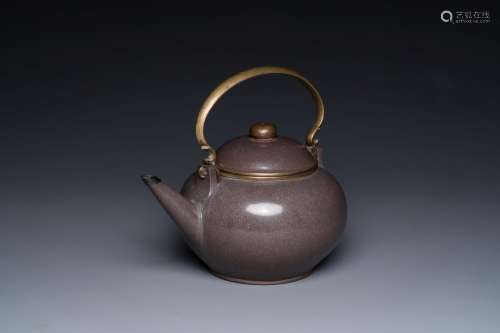 A Chinese polished purple Yixing stoneware teapot and cover ...