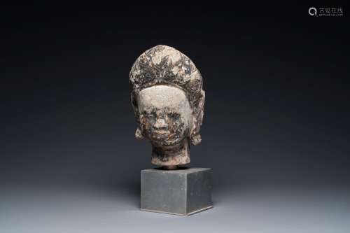 A Khmer stone head with traces of polychromy, Cambodia or Th...