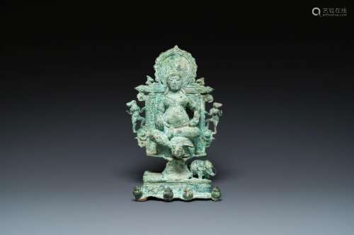 A bronze group with Kubera on a throne, Central Java, Indone...