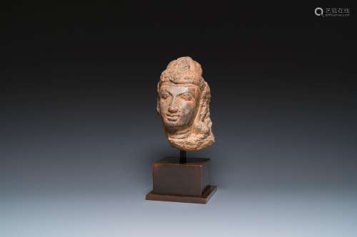 A Javanese carved andesite stone head of Shiva, Indonesia, p...