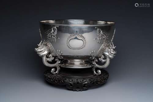 A large Chinese silver bowl resting on three dragon feet, ma...
