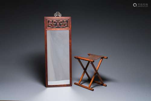 A Chinese wooden mirror and a foldable stool, 19/20th C.