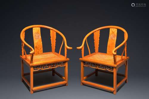 A pair of Chinese elmwood 'horseshoe' chairs, Republic