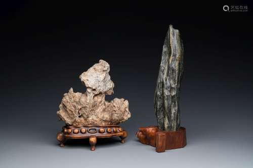 Two Chinese 'gongshi or 'scholar's rocks' on wooden stands, ...