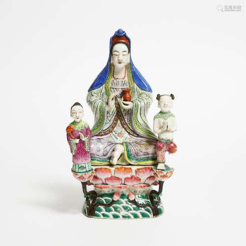 A Famille Rose Seated Figure of Guanyin and Attendants, 18th...