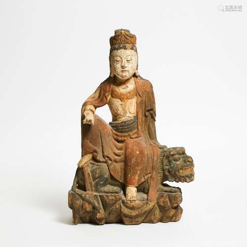 A Polychrome Wood Figure of Guanyin Seated on a Lion, Qing D...